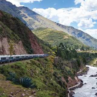 The Andean Explorer weaves through the verdant Andes en-route to Lake Titicaca, following the meandering Urubamba River.