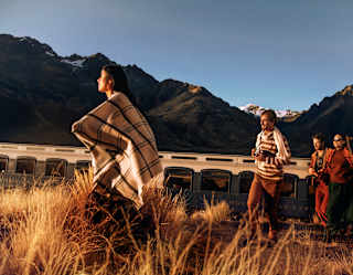 three people come out of the train and exploring the field