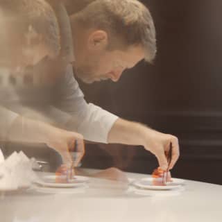 Long exposure shot of Pastry Chef Benoit Belin as he prepares a sweet treat for an Afternoon Tea at The Cadogan Lounge.