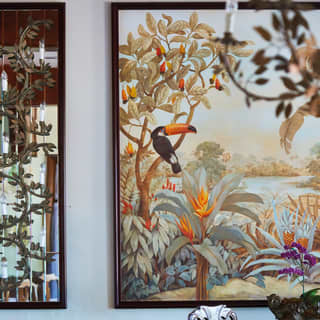 Close-up of a fresco featuring a toucan in a tree