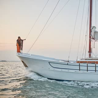 Luxurious sailing yacht crossing the Venetian lagoon at sunset