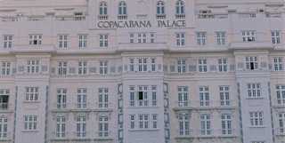 The art deco facade of Copacabana Palace with the hotel name in gold lettering