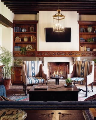 Hotel room lounge seating area dressed with blue patterned fabrics