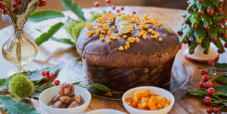 a festive panettone with a christmas ornament in the background