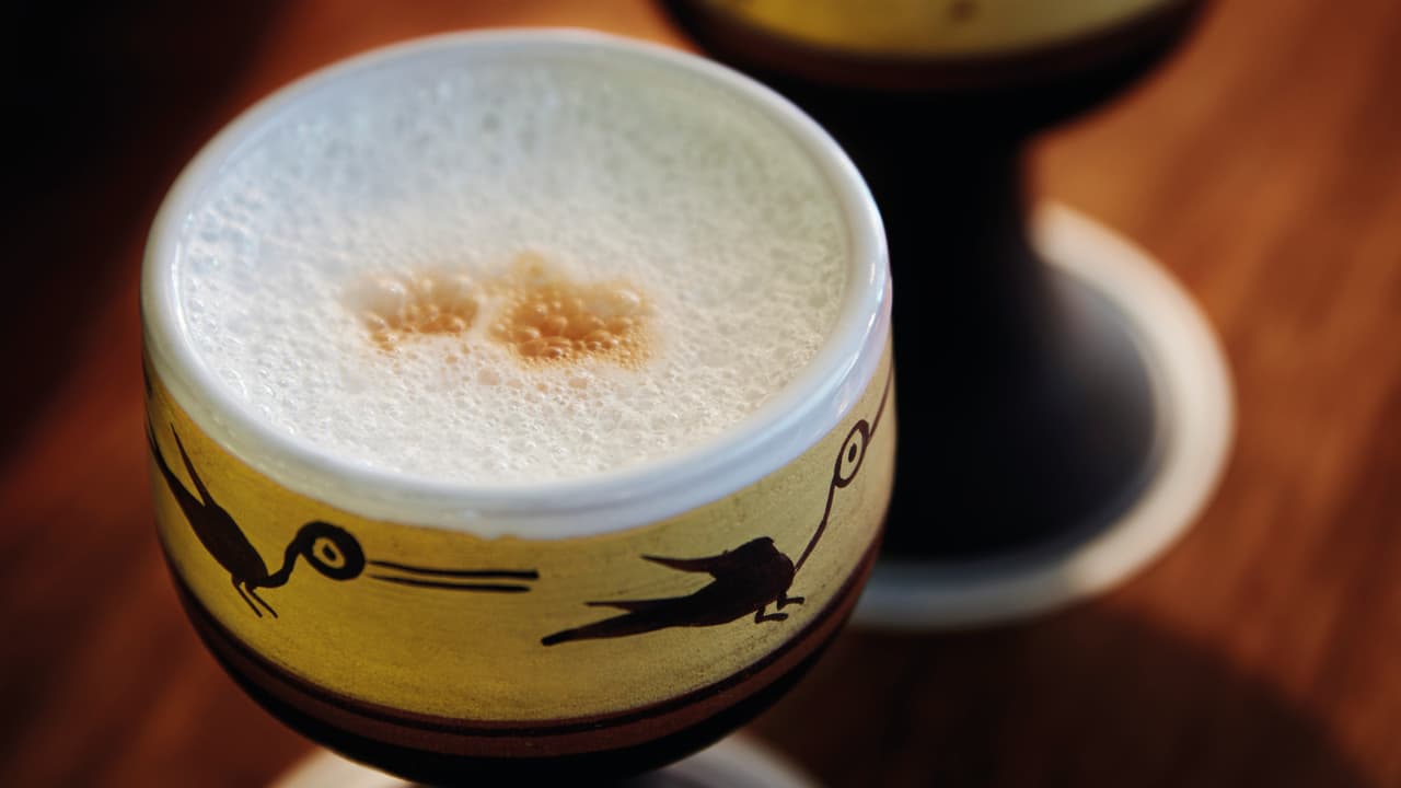 Pisco sour served with cherry
