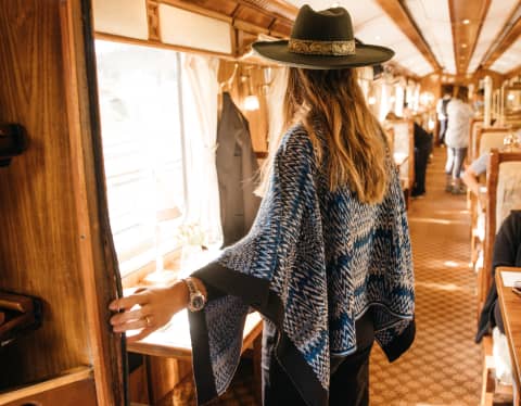 A women entering the Hiram Bingham restaurant car