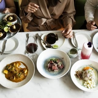 Guests enjoying a meal at Tragaluz Restaurant