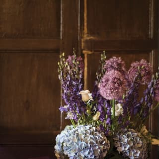 Close-up of a bouquet of purple and blue peonies, lupins and roses