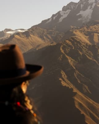 Close up shot of local woman facing the Sacred Valley
