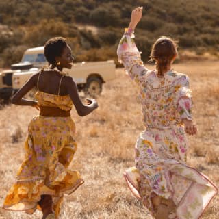 Guests enjoy the safari experience among the wildlife of the African savannah