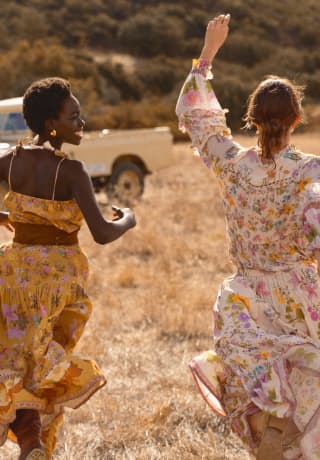 Guests enjoy the safari experience among the wildlife of the African savannah