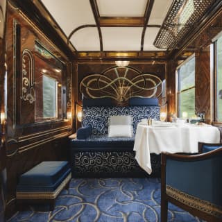 Arranged for day, with deep blue carpets and upholstered folding bed, Le Lac Suite reflects the drama and romance of water.